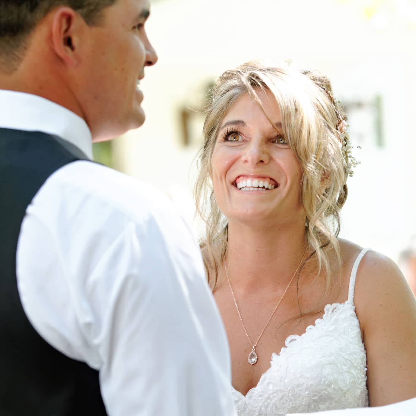 bride reacting to grooms vows