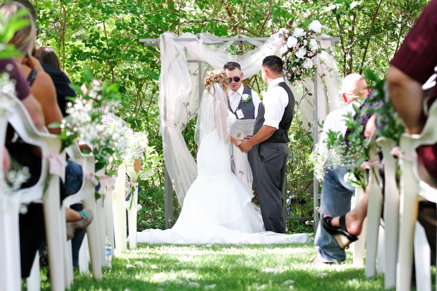 bride and groom at outdoor altar