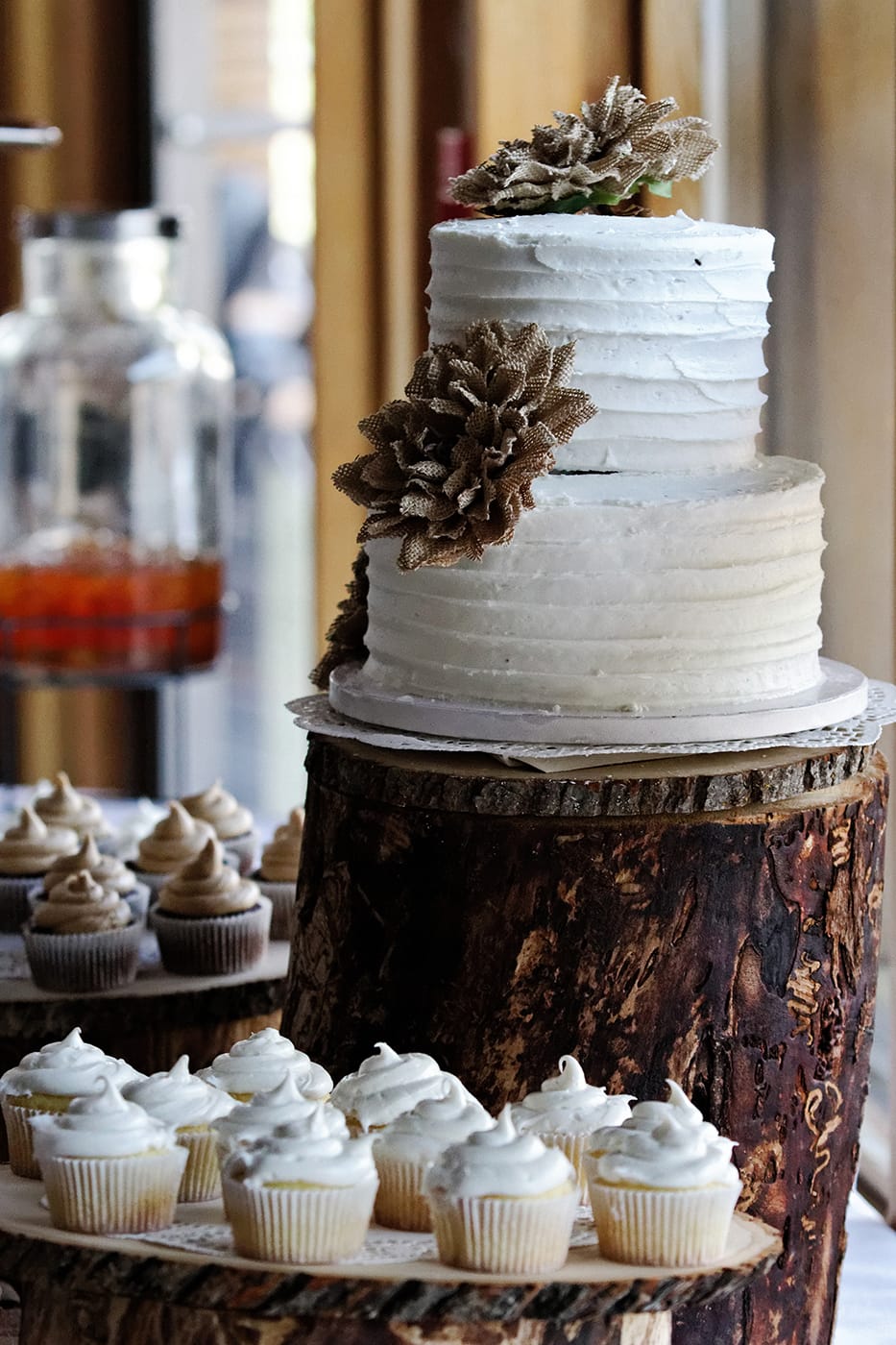 wedding cake on display with other deserts